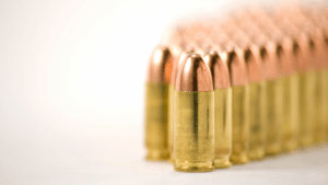 And image of 9mm ammunition on a table, for the article best progressive reloading presses.